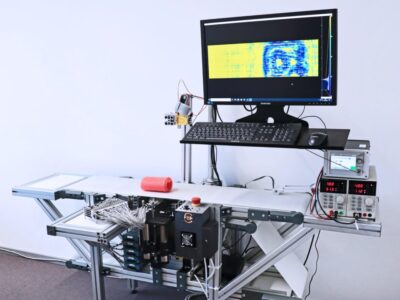 First terahertz line scanner with monolithically integrated detector