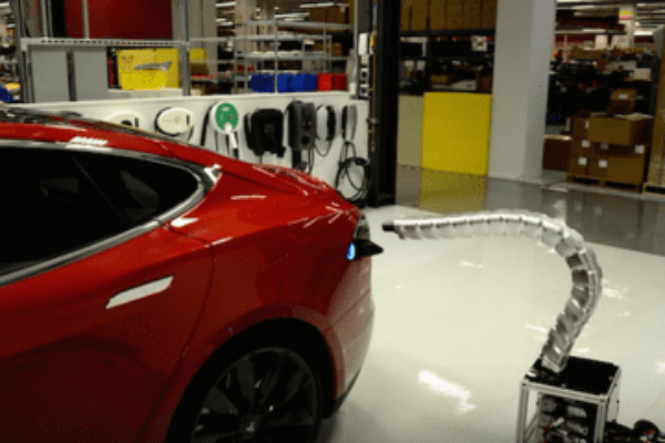 Tesla reveals snakebot electric car charger